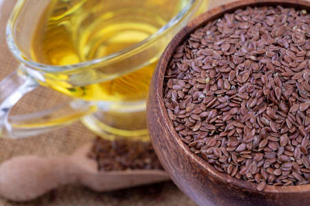 Flax seeds and oil isolated on white backgroundの写真素材