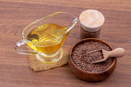 Flax seeds and oil isolated on white backgroundの写真素材