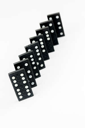 Falling dominoes. Domino effect. The domino game.の写真素材