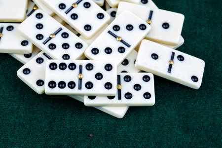 Falling dominoes. Domino effect. The domino game.の写真素材