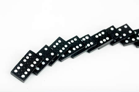 Falling dominoes. Domino effect. The domino game.の写真素材