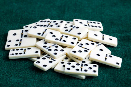 Falling dominoes. Domino effect. The domino game.の写真素材