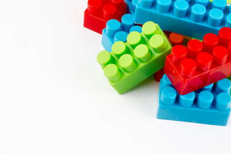 Children toys; colorful plastic blocks on the white background.の写真素材