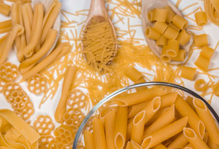 Pastry, concept photo in the kitchen; raw macaroni.