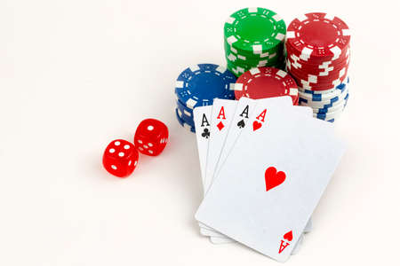 Ace playing cards with red dice. Casino betting and gambling concept and poker chips.