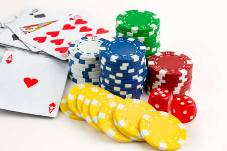 Ace playing cards with red dice. Casino betting and gambling concept and poker chips.
