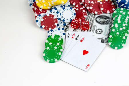 Ace playing cards with red dice. Casino betting and gambling concept and poker chips.