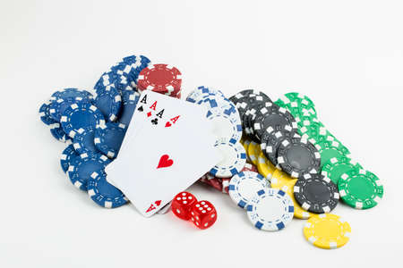 Ace playing cards with red dice. Casino betting and gambling concept and poker chips.