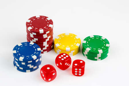 Ace playing cards with red dice. Casino betting and gambling concept and poker chips.の写真素材
