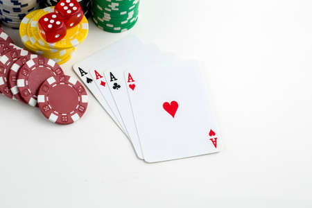 Ace playing cards with red dice. Casino betting and gambling concept and poker chips.