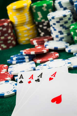 Ace playing cards with red dice. Casino betting and gambling concept and poker chips.