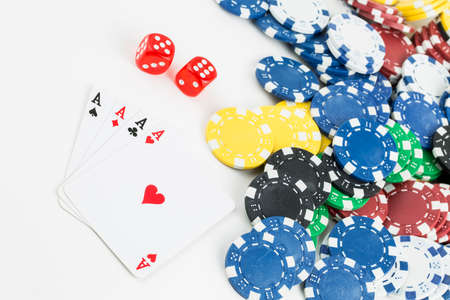 Ace playing cards with red dice. Casino betting and gambling concept and poker chips.