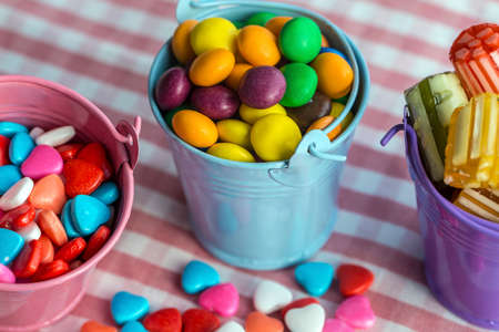 Colorful lollipops and different colored round candy. Top view.