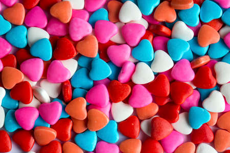 Colorful lollipops and different colored round candy. Top view.