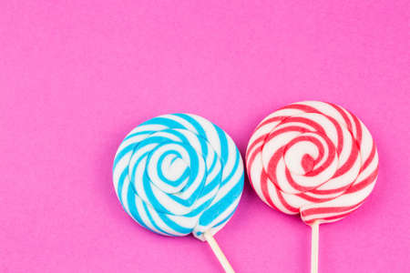 Colorful lollipops and different colored round candy. Top view.の写真素材