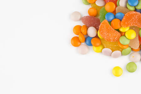 Colorful lollipops and different colored round candy. Top view.の写真素材