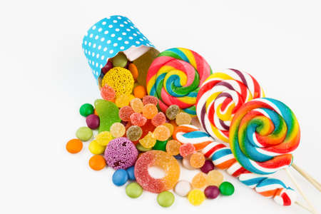 Colorful lollipops and different colored round candy. Top view.の写真素材