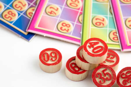Colorful bingo game cards and numbers on white background, close up, isolated.の写真素材