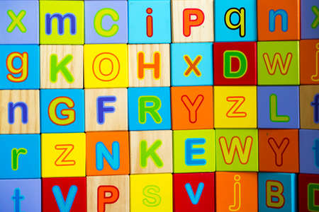 Wooden alphabet on the white background. Concept photo.