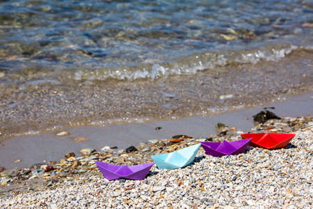 Paper ship and sea. Travel concept photo.の写真素材