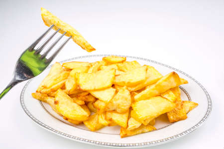 Turkish style fried potatoes on the white background.