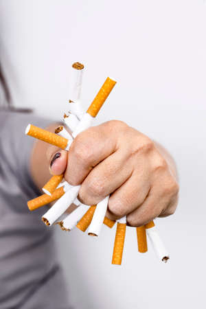 Man trying to quit smoking. Conceptual image. No smoking message.