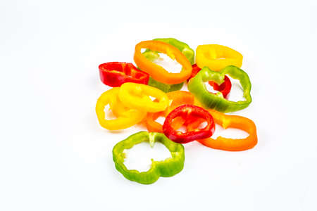 Fresh colorful peppers on the white backgroundの写真素材