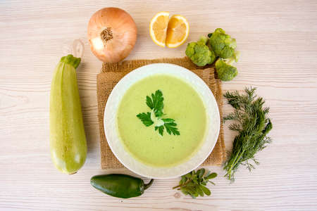 Vegetable soup with ingredients carrot cauliflower potato parsley pepperの写真素材