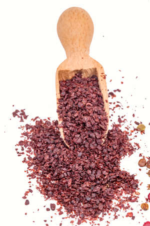 Ground sumac spice powder isolated on white backgroundの写真素材