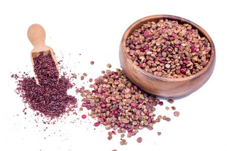 Ground sumac spice powder isolated on white background