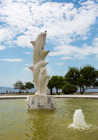 Travel concept photo. Izmir / Karsiyaka / Bostanli / Turkey. Dolphins sculpture.のeditorial素材
