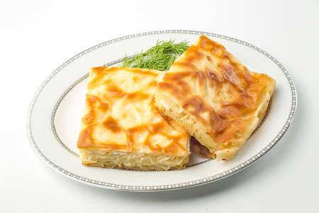 Turkish style meat and cheese stuffed filo dough borek served su boregi