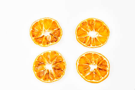 Dried orange slices, cinnamon and star anise isolated on whiteの写真素材