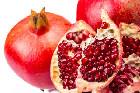Ripe pomegranate fruit isolated on white background cutoutの写真素材