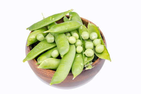 Fresh green pea vegetables on the white backgroundの写真素材