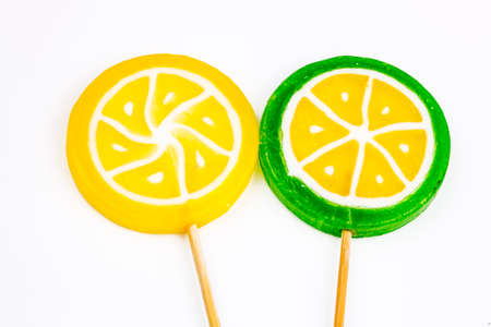 Colorful lollipops and different colored round candy. Top view.