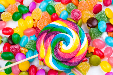 Colorful lollipops and different colored round candy. Top view.の写真素材