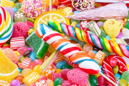 Colorful lollipops and different colored round candy. Top view.の写真素材