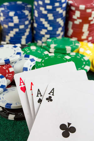 Person playing poker and looking at cards