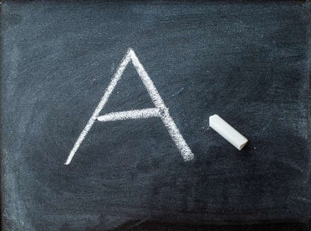 Blackboard with white chalk and letter A. Back to school concept.の写真素材