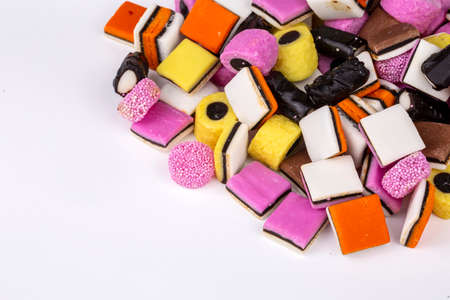 Liquorice allsorts fondant and licorice sweets or candy studio isolatedの写真素材