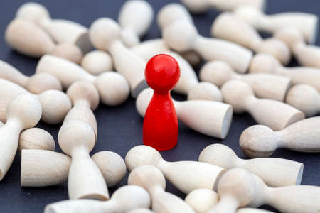 wooden figures of people on a black background, close-upの写真素材