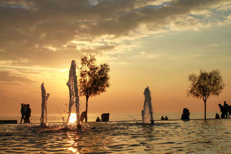 Silhouette of a fountain at sunset on Lake Balaton, Hungaryの写真素材