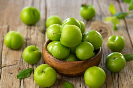 Close Up Of Green Plums Or Greengage In A Basketの写真素材