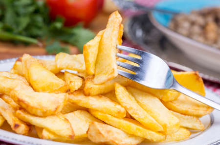 Turkish style fried potatoes on the white background.の写真素材