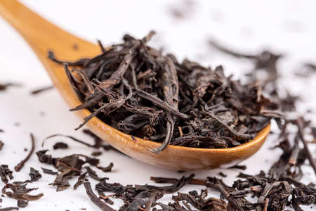 Heap of black tea dried leaves