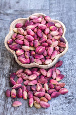 Fresh raw pistachio nuts in shell natural background. Fresh pistachios for sale at a street market....