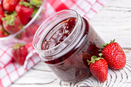 Homemade delicious strawberry jam and strawberryの写真素材