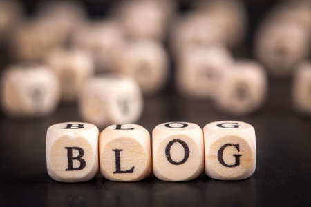 word blog on wooden cubes on a black background. business concept.の写真素材