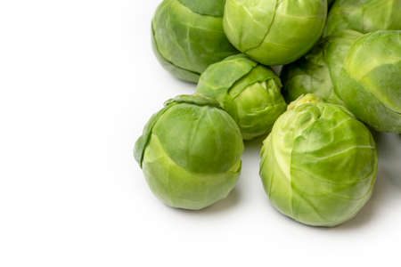 Green fresh brussels sprouts on the white backgroundの写真素材